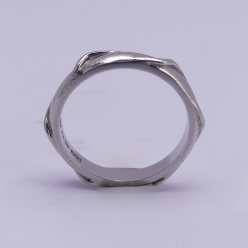 171 - A Platinum Wedding Band, of hexagonal form, Size N, 5.2g.