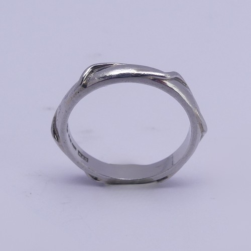 171 - A Platinum Wedding Band, of hexagonal form, Size N, 5.2g.