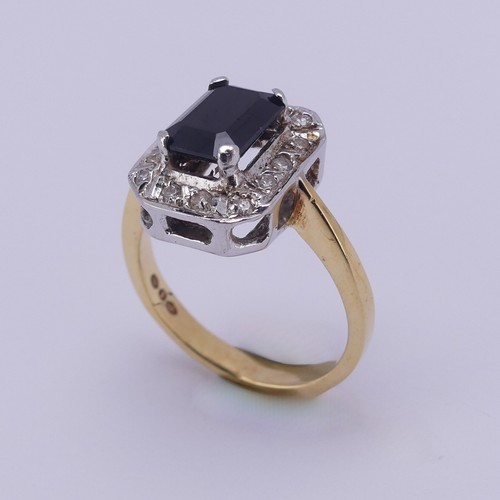 201 - A sapphire and diamond cluster Ring, the emerald cut sapphire approx. 1.5ct, four claw set in white ... 