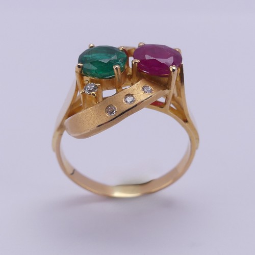 208 - A contemporary ruby and emerald Ring, the oval facetted stones, each approx. 0.7ct, claw set within ... 