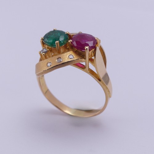 208 - A contemporary ruby and emerald Ring, the oval facetted stones, each approx. 0.7ct, claw set within ... 