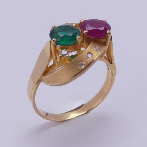 208 - A contemporary ruby and emerald Ring, the oval facetted stones, each approx. 0.7ct, claw set within ... 