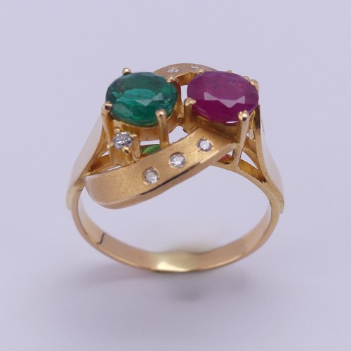 208 - A contemporary ruby and emerald Ring, the oval facetted stones, each approx. 0.7ct, claw set within ... 