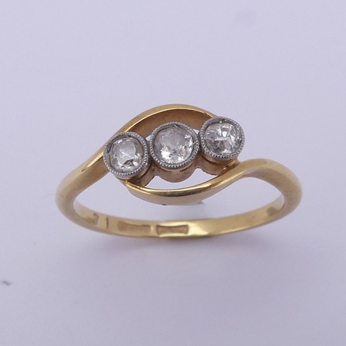 209 - A three stone diamond Ring, the old cut stones millegrain set in 18ct yellow gold and platinum, appr... 