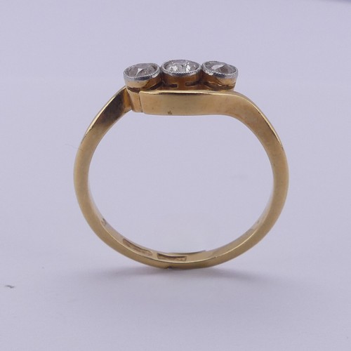 209 - A three stone diamond Ring, the old cut stones millegrain set in 18ct yellow gold and platinum, appr... 