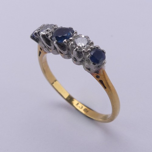 210 - A sapphire and diamond five stone Ring, the central sapphire approx. 4mm diameter, mounted in 18ct g... 