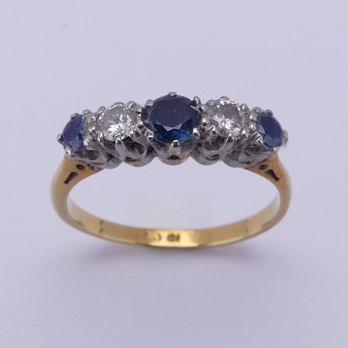 210 - A sapphire and diamond five stone Ring, the central sapphire approx. 4mm diameter, mounted in 18ct g... 