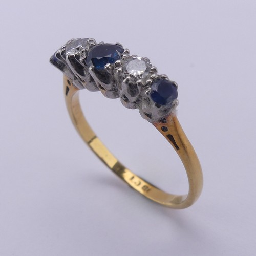 210 - A sapphire and diamond five stone Ring, the central sapphire approx. 4mm diameter, mounted in 18ct g... 