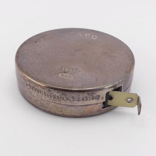 97 - Tiffany & Co.; A circular silver Tape Measure, 2m / 79