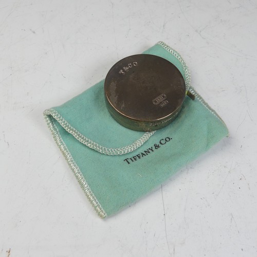 97 - Tiffany & Co.; A circular silver Tape Measure, 2m / 79