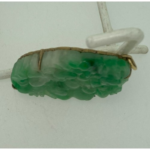 272 - A Chinese Jade Pendant, carved and pierced with a rodent amongst foliage and flowers, unmarked yello... 