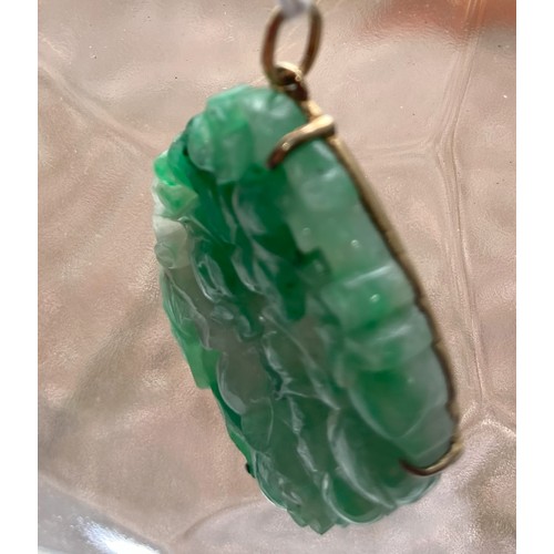 272 - A Chinese Jade Pendant, carved and pierced with a rodent amongst foliage and flowers, unmarked yello... 