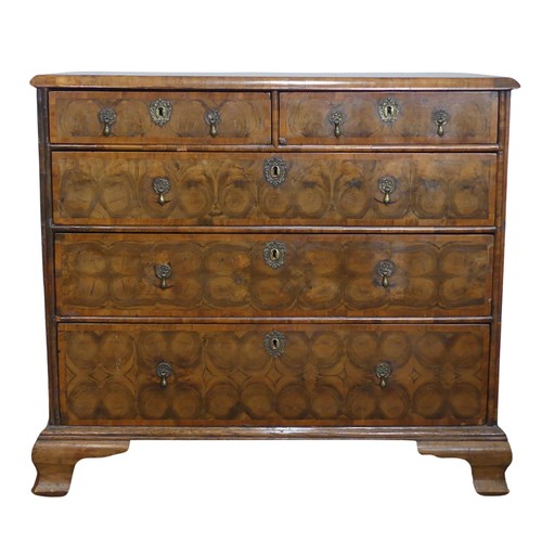 340 - An early 18th century walnut oyster veneered Chest of drawers, the rectangular moulded top with radi... 