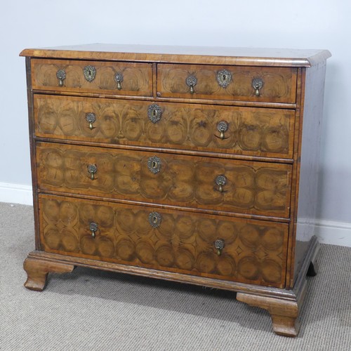 340 - An early 18th century walnut oyster veneered Chest of drawers, the rectangular moulded top with radi... 