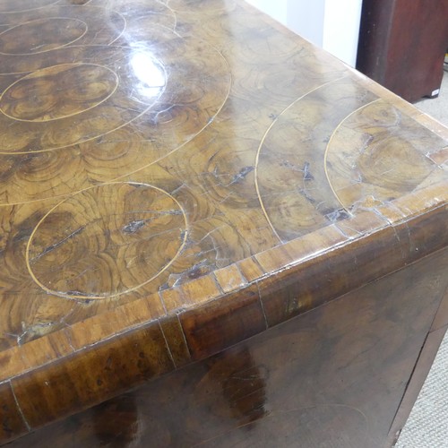 340 - An early 18th century walnut oyster veneered Chest of drawers, the rectangular moulded top with radi... 