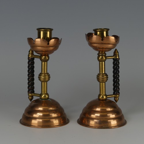 342 - A pair of Arts and Crafts copper and brass Candlesticks, designed by Dr Christopher Dresser probably... 