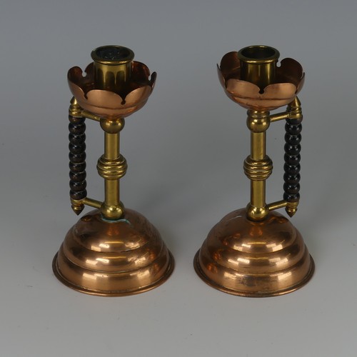 342 - A pair of Arts and Crafts copper and brass Candlesticks, designed by Dr Christopher Dresser probably... 