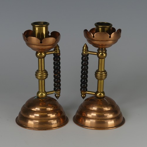 342 - A pair of Arts and Crafts copper and brass Candlesticks, designed by Dr Christopher Dresser probably... 