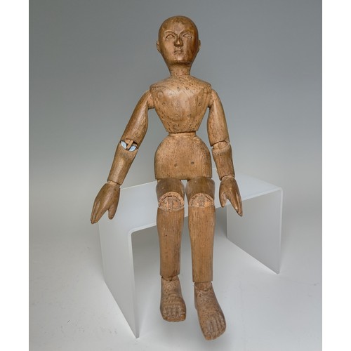 A rare miniature 19th century pine articulated artists Lay figure, the well carved figure with finely carved facial features, hands and feet, moving joints, H 16 cm, note damage to left arm, see images. 