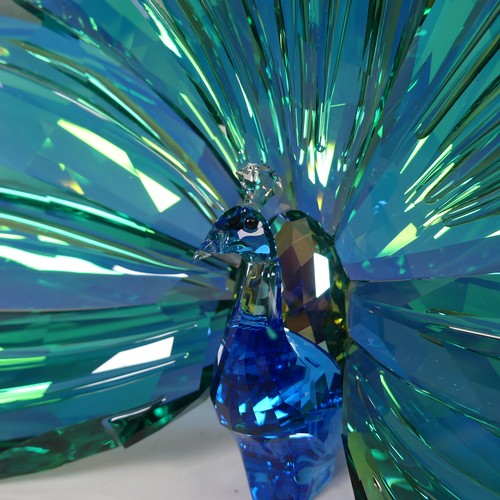 18 - A Swarovski Crystal Glass 'Peacock Arya' Figure, in box with paperwork and gloves, H 11cm.... 