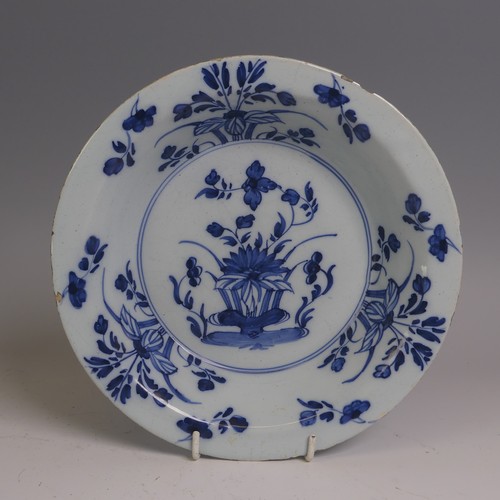 9 - A 19thC English delft Plate, possibly London, decorated in the Chinese style, with central willow ha... 