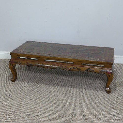 357 - A Chinese style lacquered and painted coffee Table, depicting serpents and foliage, raised on cabrio... 