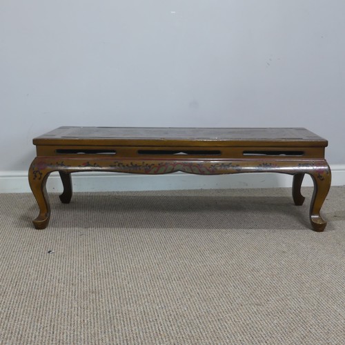 357 - A Chinese style lacquered and painted coffee Table, depicting serpents and foliage, raised on cabrio... 