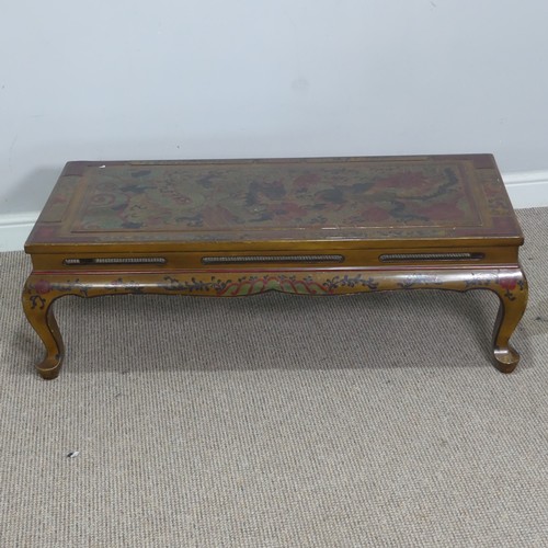 357 - A Chinese style lacquered and painted coffee Table, depicting serpents and foliage, raised on cabrio... 