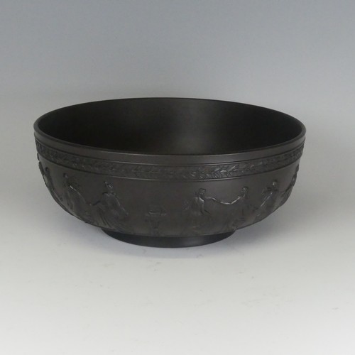 12 - A Wedgwood black basalt 'Dancing Hours' Fruit Bowl, decorated in typical style, impressed mark to ba... 