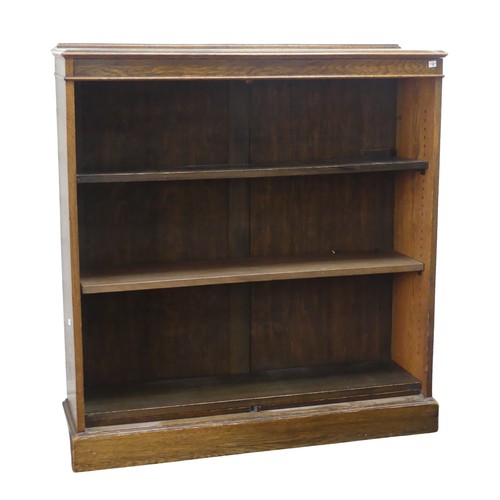 347 - A 20th century oak open bookcase, of three adjustable shelves, raised on plinth base, W 106 cm x H 1... 