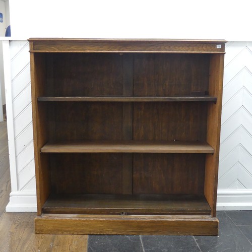 347 - A 20th century oak open bookcase, of three adjustable shelves, raised on plinth base, W 106 cm x H 1... 