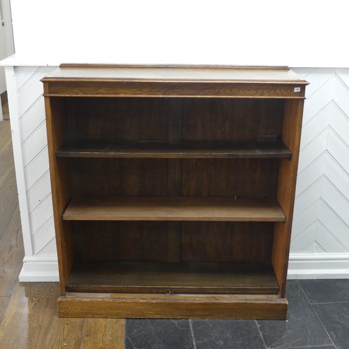 347 - A 20th century oak open bookcase, of three adjustable shelves, raised on plinth base, W 106 cm x H 1... 