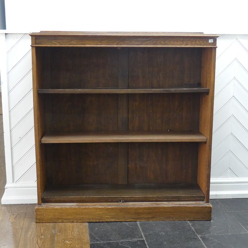 347 - A 20th century oak open bookcase, of three adjustable shelves, raised on plinth base, W 106 cm x H 1... 