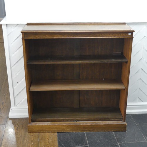 347 - A 20th century oak open bookcase, of three adjustable shelves, raised on plinth base, W 106 cm x H 1... 