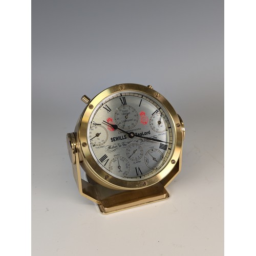 308 - A 'Sewills of Liverpool' Sealord Chronometer in brass case, subsidiary seconds dial along with therm... 