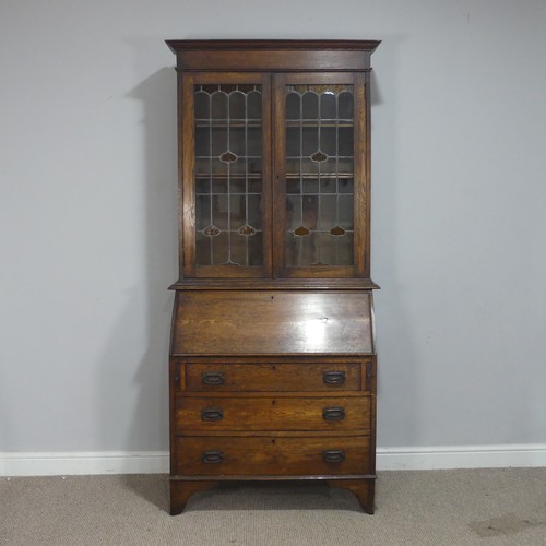 355 - An Arts and Crafts oak bureau Bookcase, cornice over lead framed stained glass, raised on Bureau bas... 