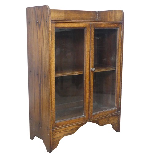 358 - An early 20th century small oak Bookcase, with glazed doors enclosing shelf, W 59.5 cm x H 89 cm x D... 