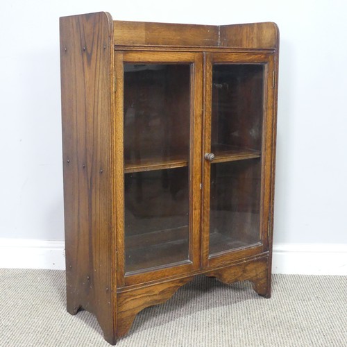 358 - An early 20th century small oak Bookcase, with glazed doors enclosing shelf, W 59.5 cm x H 89 cm x D... 