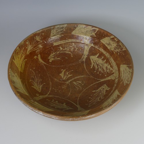 15 - An antique earthenware pottery Bowl, decorated with slipware leaves, D 29cm x H 9.5cm, together with... 