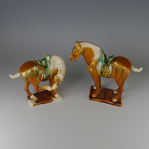 135 - A pair of Chinese Sancai porcelain Tang-style Horses, with impressed marks to base, H 20cm (2)... 