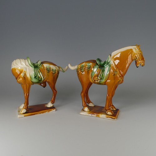 135 - A pair of Chinese Sancai porcelain Tang-style Horses, with impressed marks to base, H 20cm (2)... 