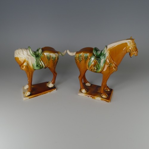 135 - A pair of Chinese Sancai porcelain Tang-style Horses, with impressed marks to base, H 20cm (2)... 