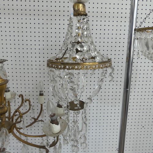 383 - An antique French style eight light brass Chandelier, with scrolled branches and glass lustre drops,... 