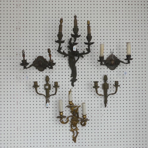 385 - An antique gilt metal three light wall Sconce, of a stylised floral design, L 50 cm, together with a... 