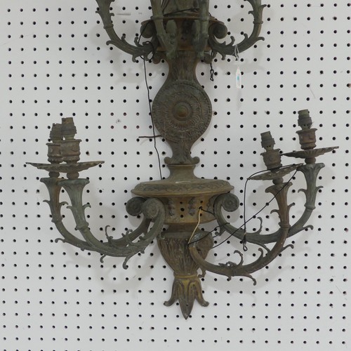 386 - A large antique gilt metal nine branch wall Sconce, foliate pediment over four scrolled branches, ab... 