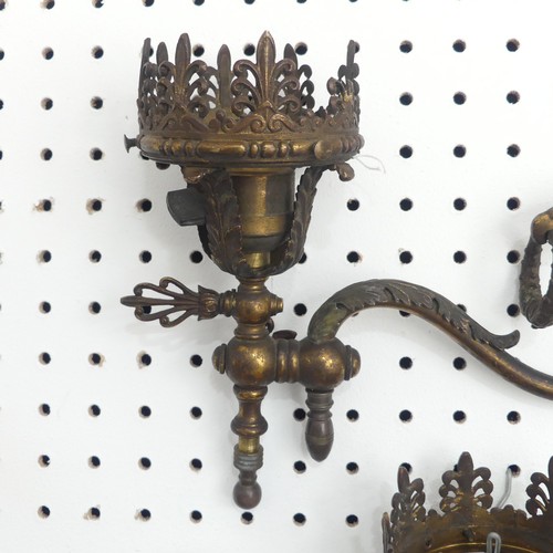 388 - A pair of possibly 19th century gilt metal wall Sconces / Lights, with scrolled and foliate decorati... 