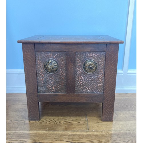 378 - A Shapland and Petter of Barnstaple oak Arts and Crafts Fireside Box, circa 1900, patinated copper f... 