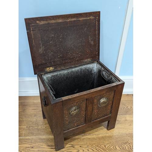 378 - A Shapland and Petter of Barnstaple oak Arts and Crafts Fireside Box, circa 1900, patinated copper f... 