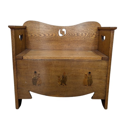 430 - A good Arts and Crafts oak Liberty & co hall Settle / Seat, backrest with pierced yin-yang decor... 