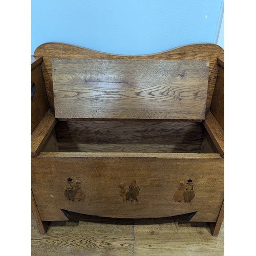 430 - A good Arts and Crafts oak Liberty & co hall Settle / Seat, backrest with pierced yin-yang decor... 